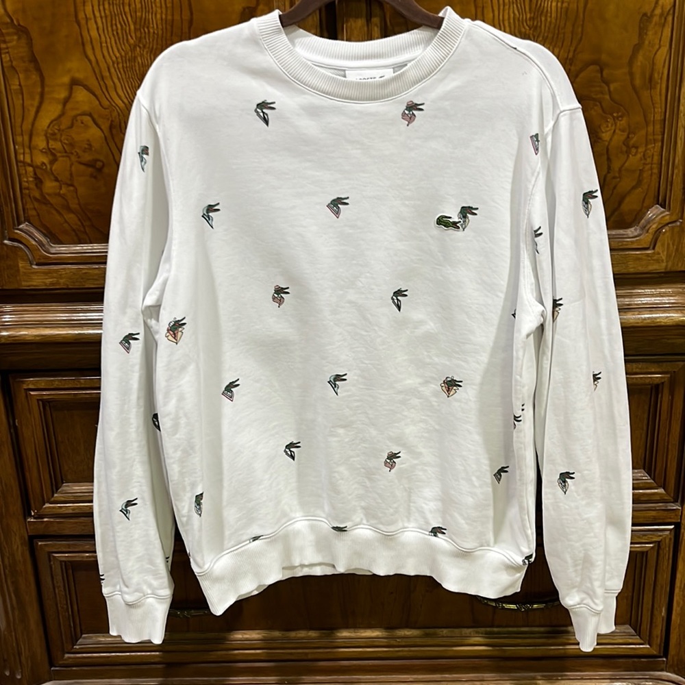 Lacoste mens fun croc pattern designed by Jean-Michel Trixier. White crew neck